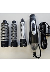 Wahl Airstyler Pro with three detachable barrels: one with metal bristles, two with smooth silver surfaces, all featuring black plastic ends and connectors.