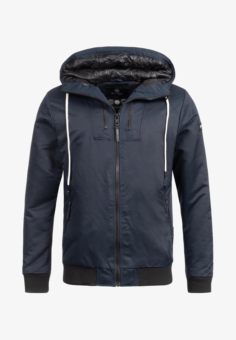 Marineblaue Jacke mit Reißverschluss vorne, Kordelzugkapuze, gerippten Bündchen und Saum. Verfügt über zwei seitliche Reißverschlusstaschen und ein gestepptes Innenfutter.