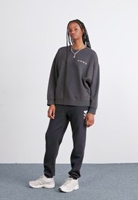 Roxy SURF STOKED BRUSHED - Tepláky - black