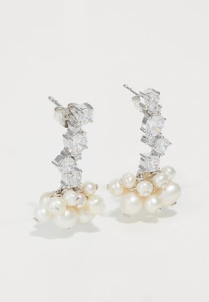 Silver earrings featuring a cluster of white pearls and sparkling clear crystals, arranged in a cascading design with post back closures.