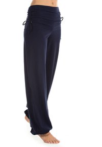 Marineblaue weit geschnittene Hosen mit einem gerafften Bund, der mit Kordeln gebunden ist. Hergestellt aus weichem Material und mit einem bequemen, fließenden Design.