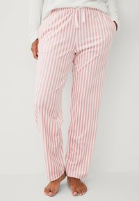 Roze en witte gestreepte pyjamabroek van zacht materiaal, met een elastische tailleband en een trekkoord, in een comfortabele pasvorm.