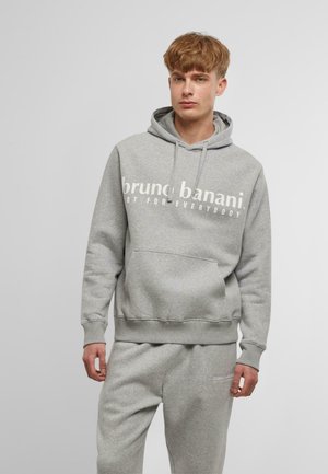 Grå sweatshirt med hætte og kengurulomme, med hvid tekst "bruno banani" og "NOT FOR EVERYBODY" tværs over brystet. Blødt stof, afslappet pasform.