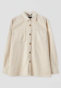 Beige corduroy shirt met verticale strepen, lange mouwen, knoopsluiting en twee voorzakken. Beschikt over een klassieke kraag en een gestructureerde stof.