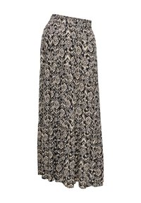 Jupe maxi avec motif losange géométrique noir et beige, taille élastique et design en tissu fluide à étages.