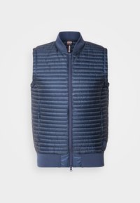Jūras zila, quiltēta, izolēta veste ar rāvējslēdzēju priekšpusē, ribota apkakle un sānu kabatām; viegla un gluda tekstūra.