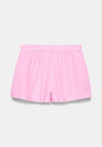Shorts en éponge rose clair avec une taille élastique, présentés à plat sur un fond blanc uni.