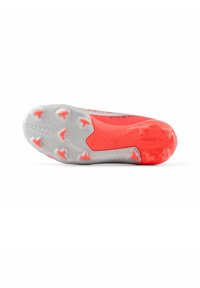 Soccer cleat with a bright coral upper, textured finish, and a gray outsole featuring multiple studs for traction.