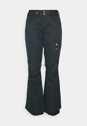 Pantalon de ski noir imperméable avec taille ajustable, poche zippée sur la cuisse et jambes évasées avec guêtres neige.