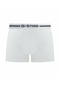 White cotton boxer shorts with a black and grey G-Star logo waistband. Features a snug fit and smooth texture.