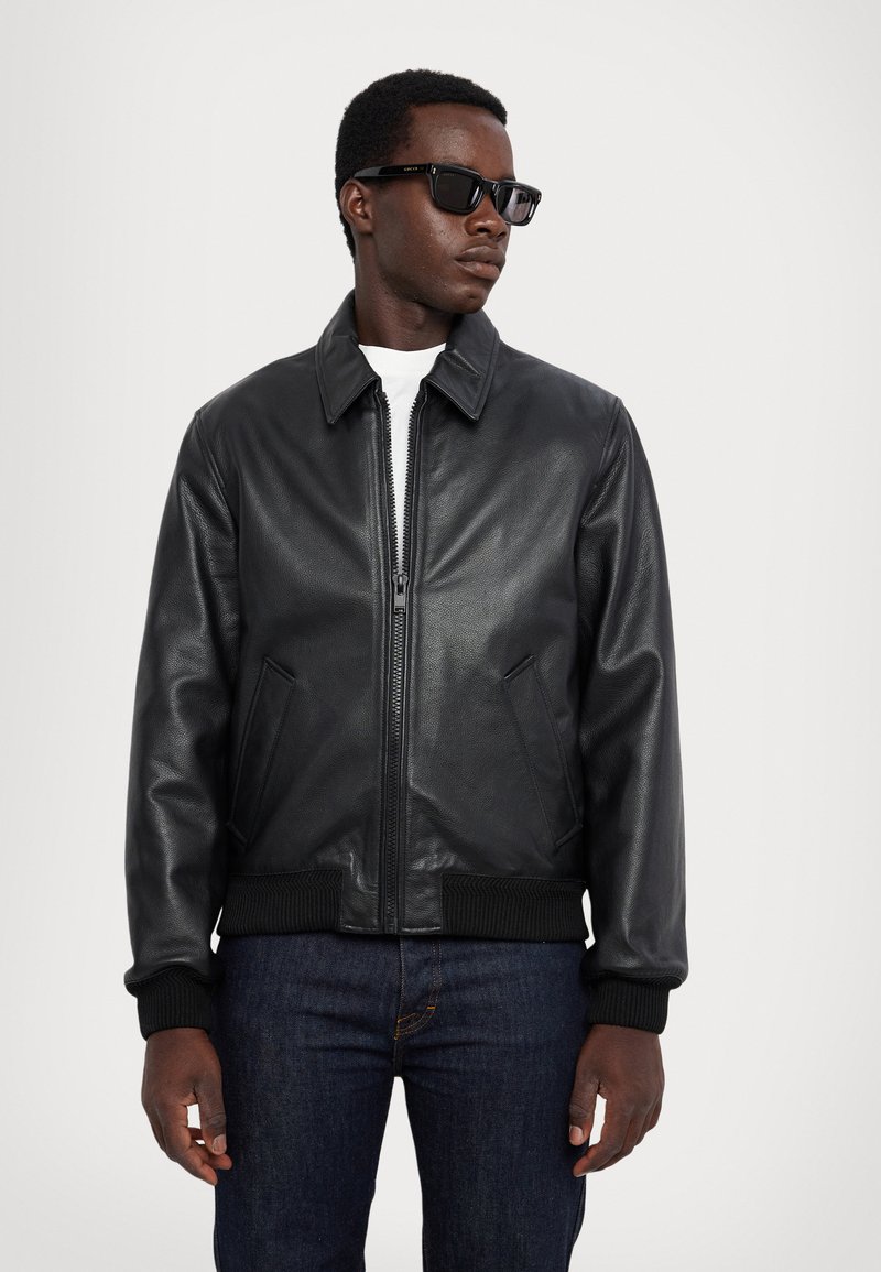 Blouson de moto en faux cuir avec ceinture Noir | Dynamite
