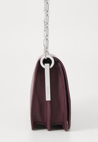 Calvin Klein CONVERTIBLE MINI BAG - Cross body bag - vineyard wine
