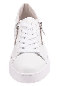 White sneakers with a smooth leather finish, featuring a lace-up design and side zipper detail. Flat rubber sole and rounded toe.