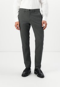 Gray tailored trousers made of textured fabric, featuring a straight-leg design and a single button closure, paired with black shoes.