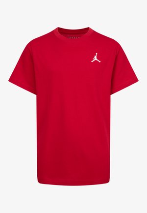 T-shirt en coton rouge à manches courtes, arborant un logo Jumpman blanc sur la poitrine gauche. Texture douce avec un col ras du cou.