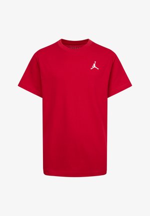 Crvena pamučna majica s kratkim rukavima, s bijelim Jumpman logom na lijevoj strani prsiju. Mekana tekstura s dizajnom okruglog izreza.