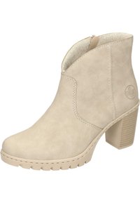 Beige ankelboot i mocka, med en något spetsig tå, en texturerad klacken och dragkedja på sidan.