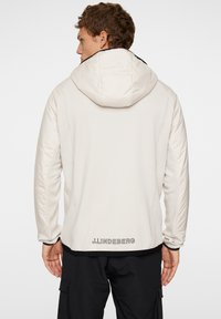 J.LINDEBERG Sports SHAWN HYBRID HOODED JACKET - Giacca outdoor - moonbeam
