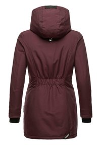 Maroon insulated jacket with a hood, elastic waist, and black ribbed cuffs. Smooth texture with a logo tag on the hem.