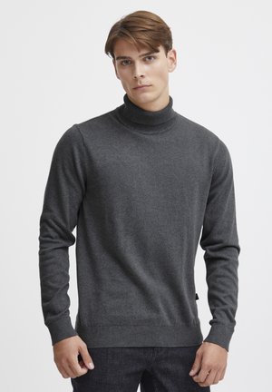 Donkergrijze coltrui van zachte stof, met lange mouwen, geribde kraag en cuffs, met een slim-fit ontwerp en een zijlabel detail.