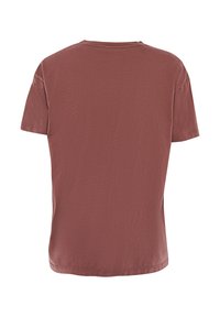 T-shirt a maniche corte, con scollo rotondo, di colore rosa smorzato, caratterizzato da una morbida texture in cotone e una forma dritta senza grafiche visibili.