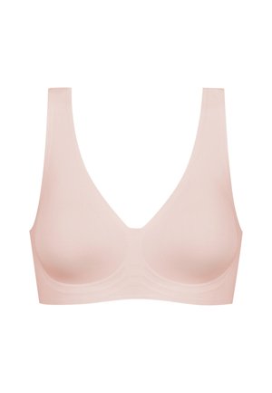 Light pink seamless bra with wide straps and a deep V-neck design; made from smooth, stretchy fabric. No clasps or underwire.