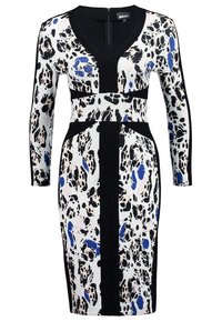 Robe à manches longues, longueur genou, avec bordure noire, motif abstrait noir et blanc et taches irrégulières bleues et rose clair.