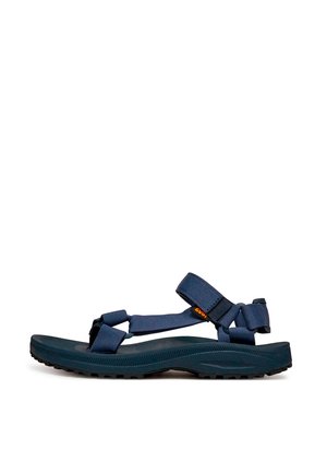 Sandale extérieure bleu marine avec brides ajustables, semelle texturée et fermeture Velcro pour un maintien sécurisé et un confort optimal.
