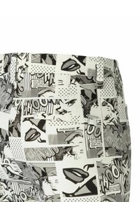 Trousers featuring a black-and-white comic strip pattern, with varied faces, speech bubbles, and textures. Includes a belt loop and pocket details.