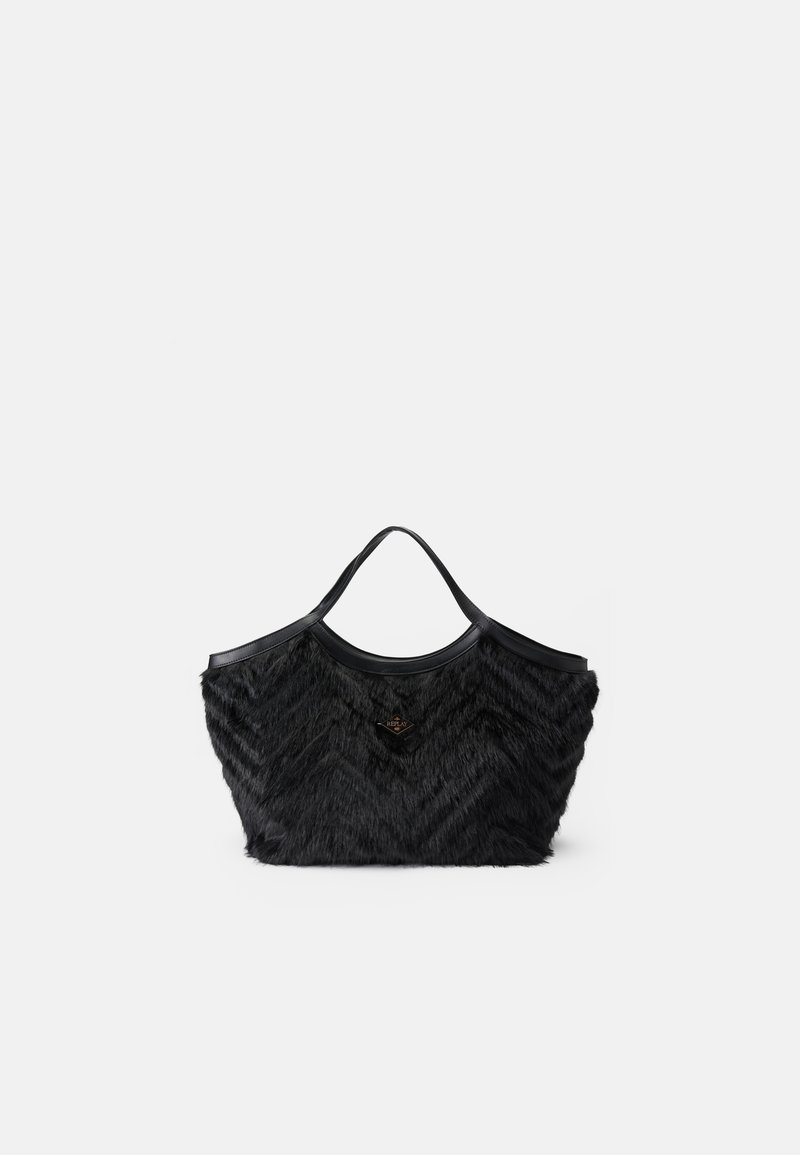 Black tote bag featuring a textured fur-like surface with a chevron pattern, complemented by a smooth black leather top and handles.