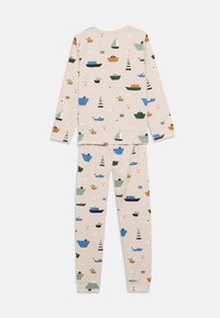 Ανοιχτό μπεζ πυτζάμες με πολύχρωμα σχέδια από βάρκες. Μακρυμάνικη μπλούζα και παντελόνια με μαλακή, λεία υφή και εφαρμοστή σχεδίαση.