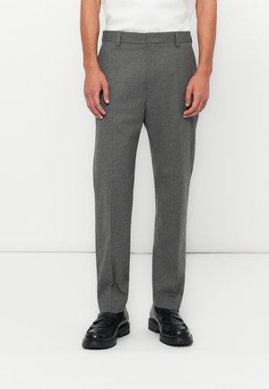 Gray tailored trousers made of textured fabric, featuring a straight-leg design, belt loops, and side pockets, paired with black loafers.
