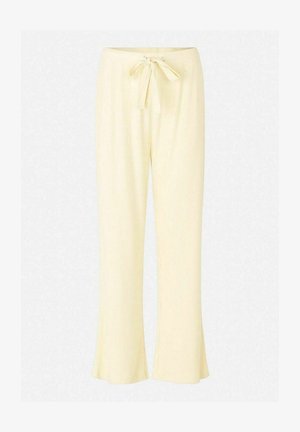 Light yellow pants with a ribbed texture, featuring a tie waist and flared hems, offering a relaxed fit and soft material.