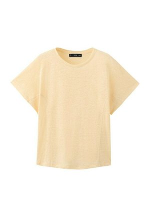 Bež kratka majica s okruglim izrezom i opuštenim krojem, prikazana na bijeloj pozadini.