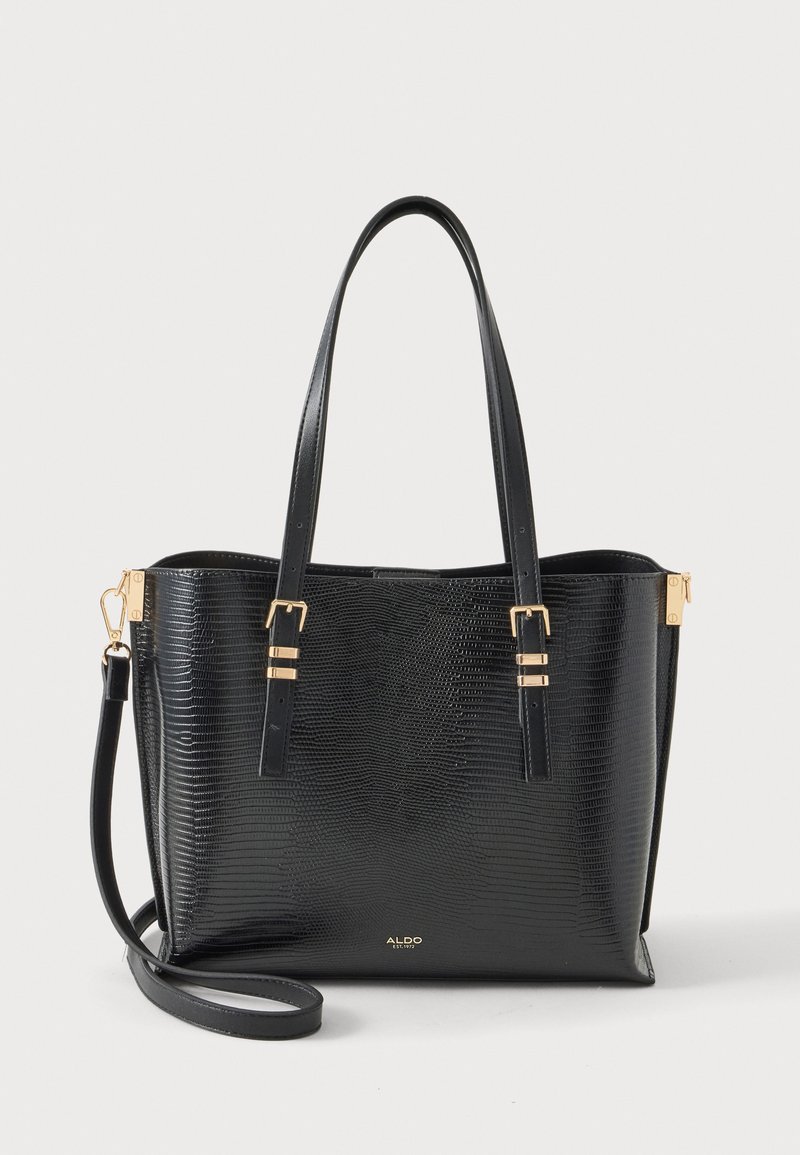 Sac cabas en cuir texturé noir avec deux longues anses, bandoulière ajustable, accents de boucle dorée et logo ALDO sur le devant.