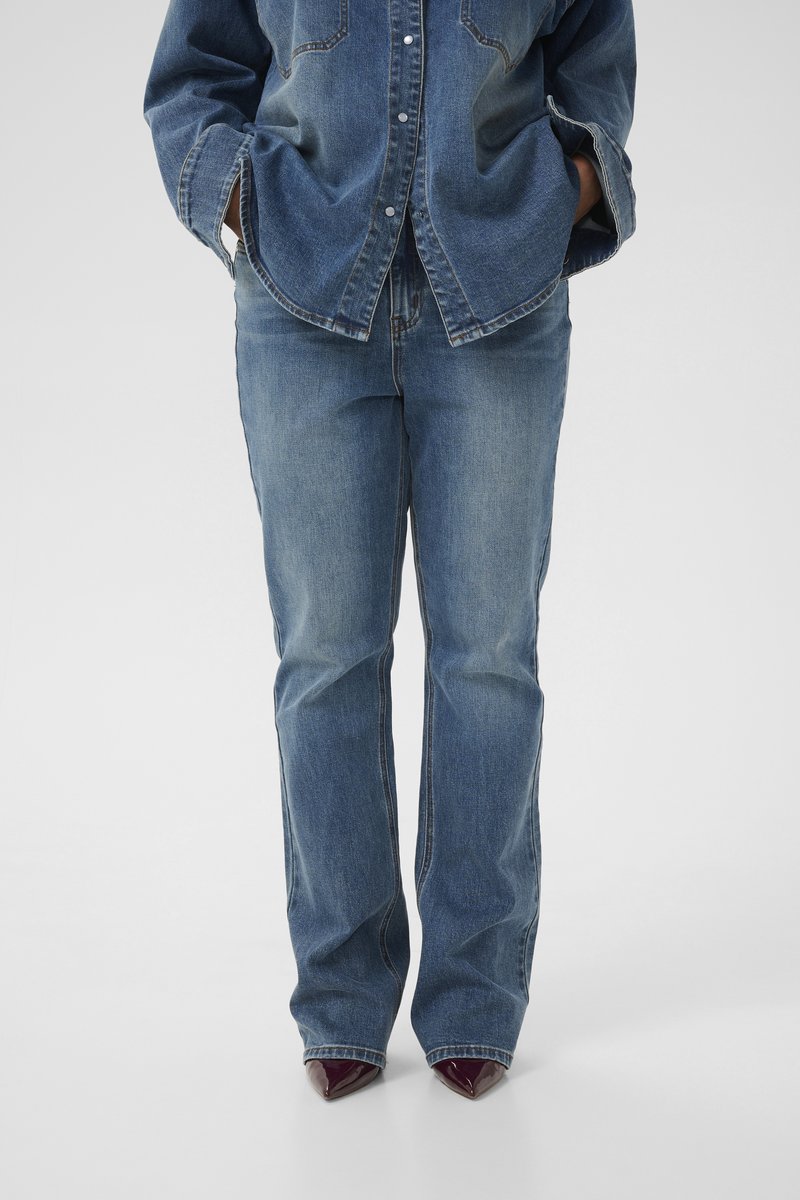 Light blue denim jeans with a straight-leg cut, featuring a classic five-pocket design and subtle stitching details.