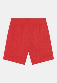 Red mesh shorts with an elastic waistband, featuring a breathable design and short length. Textured surface with small perforations.