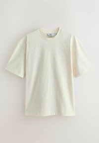 Short-sleeve T-shirt in light cream, made of smooth cotton. Features a crew neckline and relaxed fit. No visible patterns or accents.