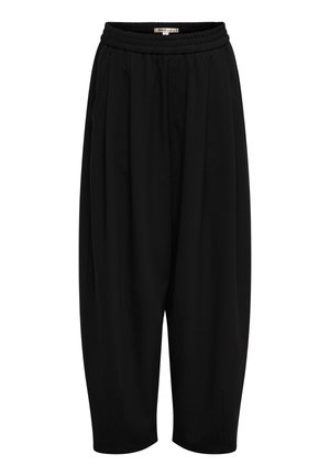 Pantalon court ample noir avec taille élastique et poches latérales, présentant une coupe décontractée et un design de jambe effilée.