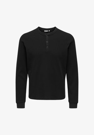 Musthave musta pika varrukaga henley särk, mis on valmistatud tekstuuriga kangast, millel on kolm nööpi, ümar kaelus ja vormitud mansetid.