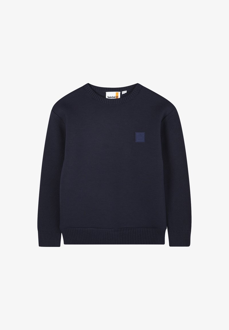 Maglione lavorato a maglia blu navy con collo rotondo, polsini e orlo a coste, caratterizzato da un motivo testurizzato sulle maniche e un piccolo logo patch.