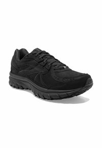 Zwarte sportieve schoenen van suede en mesh, met een gestructureerde zool, vetersluiting en een gebogen, gestroomlijnde silhoët.