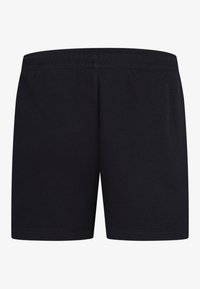Pantalones cortos de algodón negros con una cinturilla elástica, una textura suave y sin patrones o herrajes visibles. Presenta un diseño sencillo y minimalista.