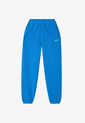 Helle blaue Sweatpants mit elastischem Bund und Bündchen, Seitentaschen und "American Vintage" Logo am linken Oberschenkel.