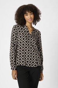 Langärmlige Bluse mit einem schwarz-beigen Rautenmuster. Weiches Material mit V-Ausschnitt und lockerer Passform. Geeignet für verschiedene Anlässe.