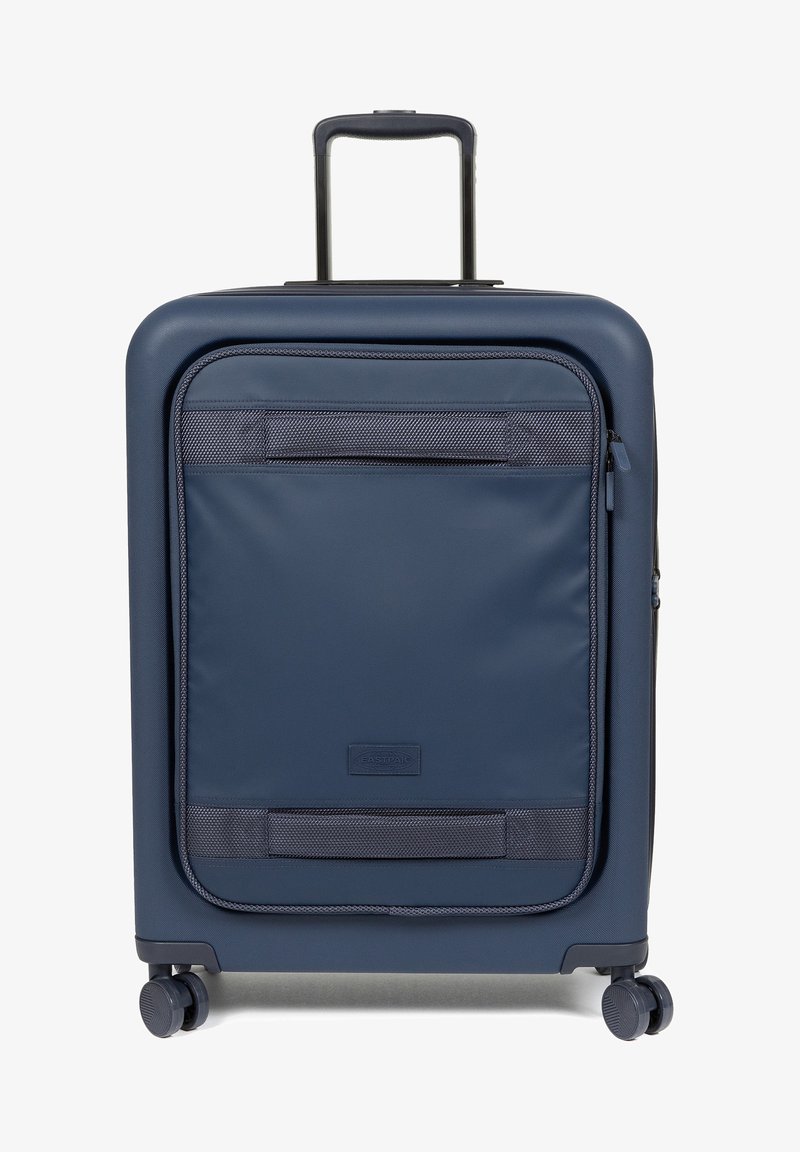 Navy hard-shell suitcase with a textured finish, zippered front pocket, telescoping handle, and four wheels for easy mobility.