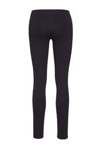 Leggings noirs en tissu extensible au design ajusté, dotés d'une taille élastique, d'une texture lisse et sans coutures visibles.