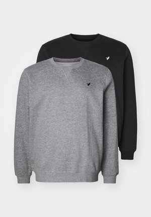 Zwei Rundhalsausschnitt-Sweatshirts in Grau und Schwarz. Das graue sweatshirt hat eine dezente Textur, und beide sind mit einem kleinen gestickten Logo auf der Brust versehen.