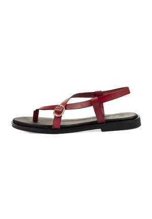 Chanclas de cuero rojo con suela plana negra, que presentan tiras delgadas y un detalle de hebilla circular. El diseño es minimalista y casual.