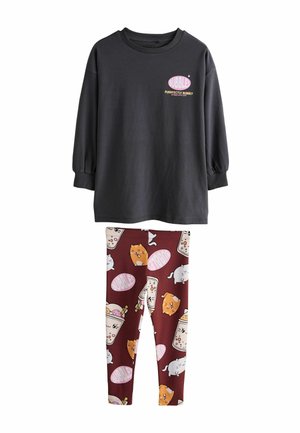 Black long-sleeve top with "BUBBLE" graphic and maroon leggings featuring playful cat and drink patterns. Made of soft cotton fabric.